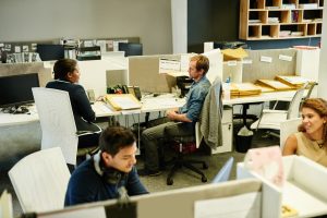 Shot of a group of colleagues working together in an office.